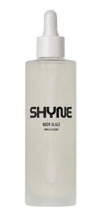 Frosted glass prototype bottle of SHYNE Body Glaze in Vanilla Sugar with a white dropper cap
